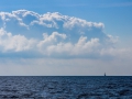 Horizon, clouds and blue sky